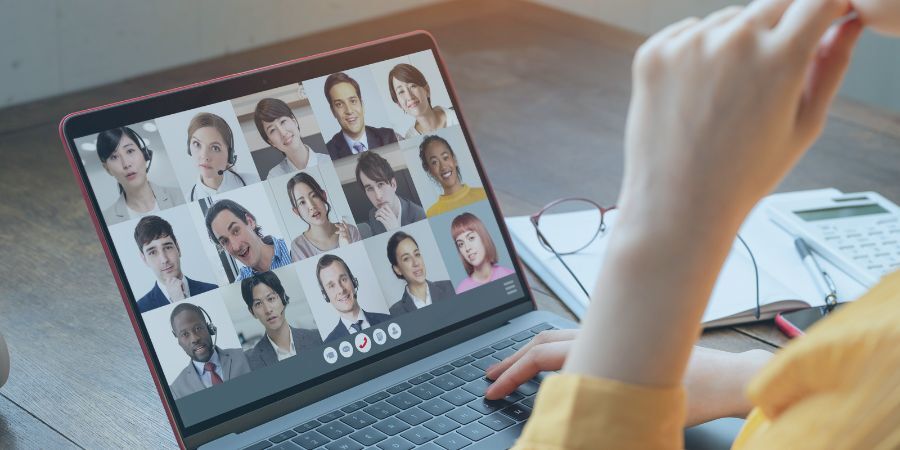 Laptop screen showing a video conference C2