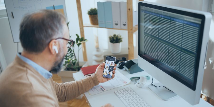 Man in front of his laptop working from home C2